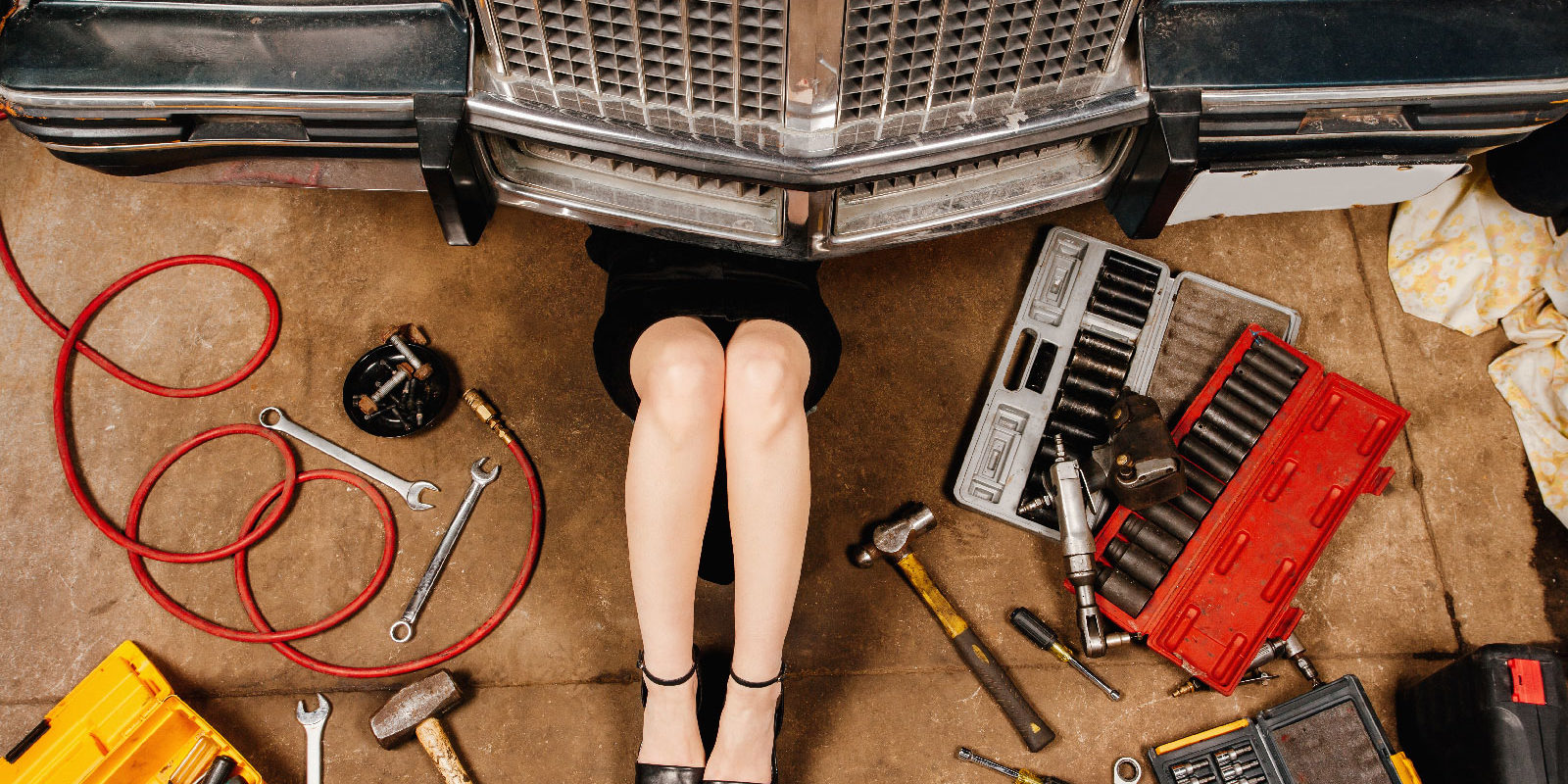 woman-repairing-her-car