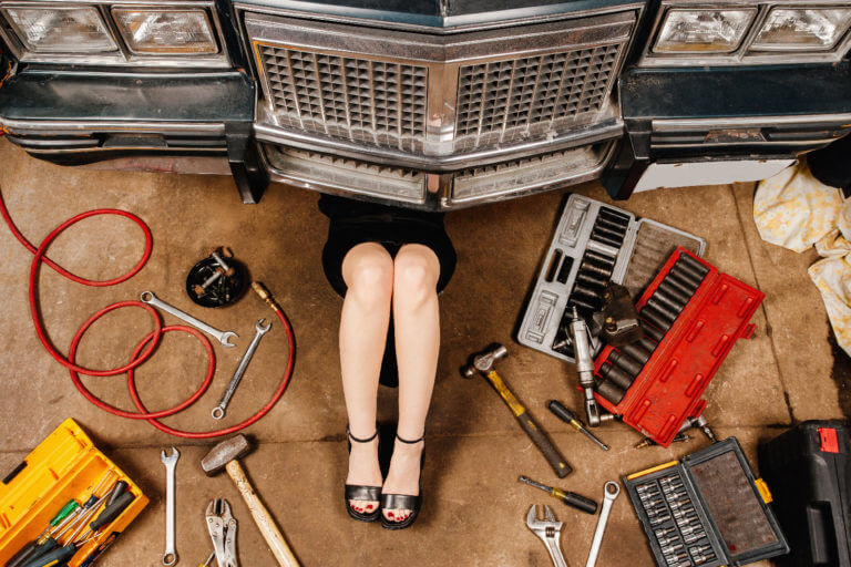 woman-repairing-her-car